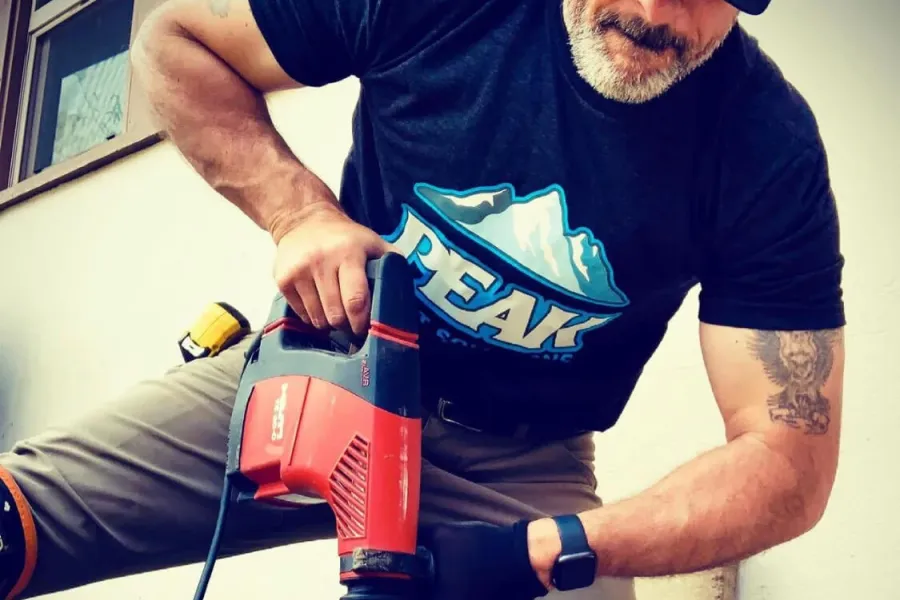 A Peak Pest Solutions technician works on a termite removal project